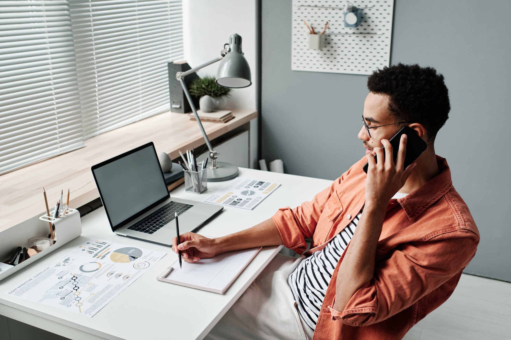 Businessman scheduling meeting in office